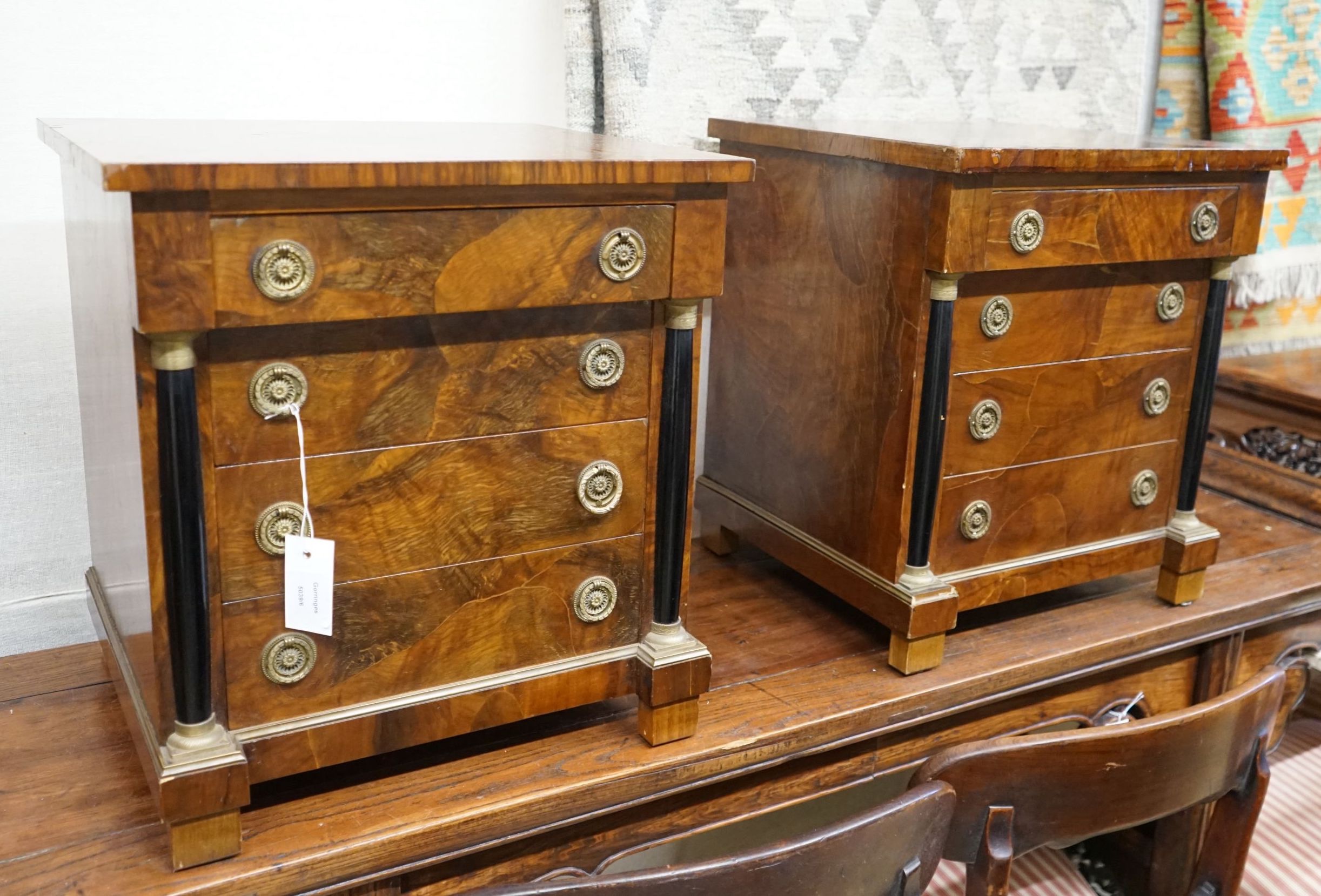 A pair of Biedermeier style walnut four drawer bedside chests, width 45cm, depth 40cm, height 48cm